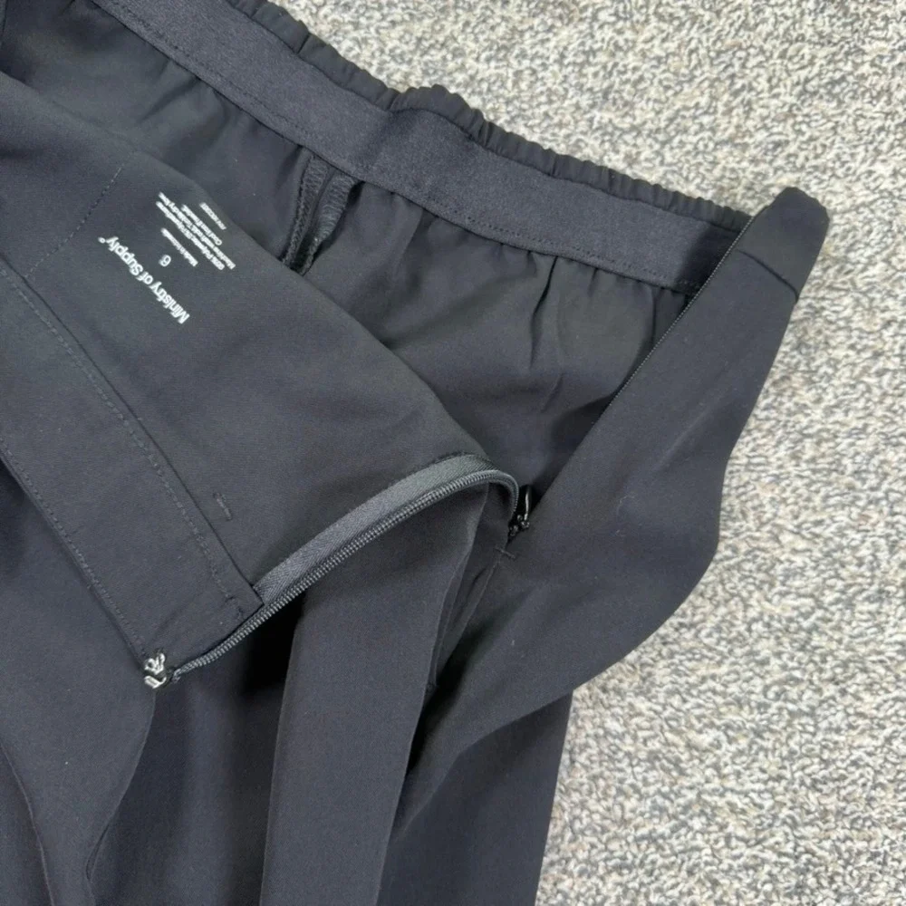 Ministry of Supply Kinetic Tapered Pants Womens 6 Black Pleated Stretch Trousers - Picture 3 of 9